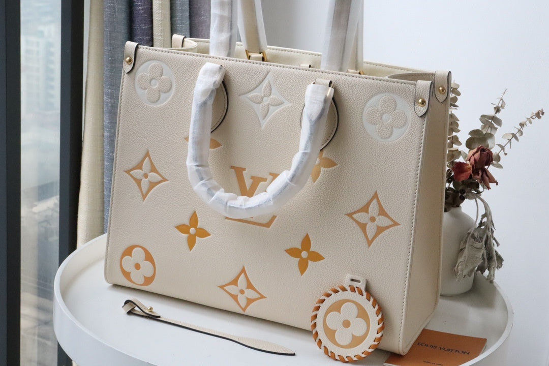 LV OnTheGo MM Tote Bag Monogram Empreinte Cream For The Pool Collection, WoHandbags 13.8in/35cm LV M45717