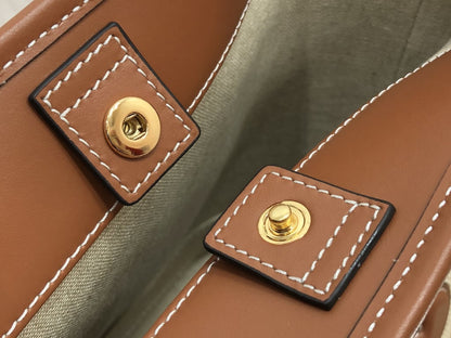 CE CUIR TRIOMPHE IN TEXTILE AND CALFSKIN NATURAL TAN BAG BUCKET
